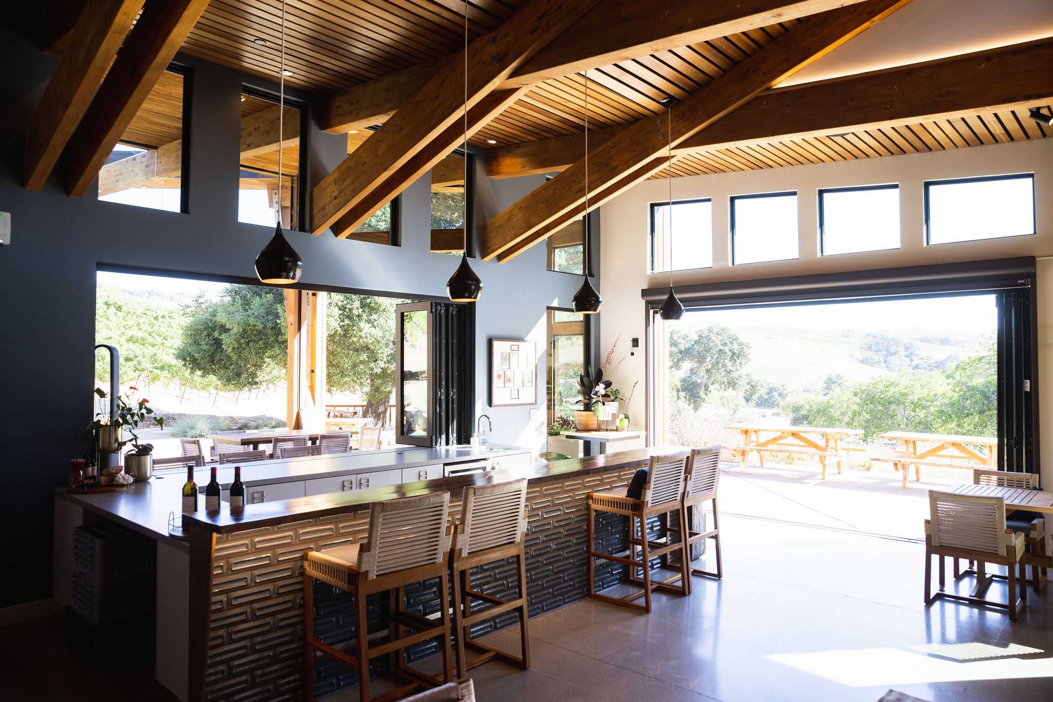 tasting room with doors open showing vineyard