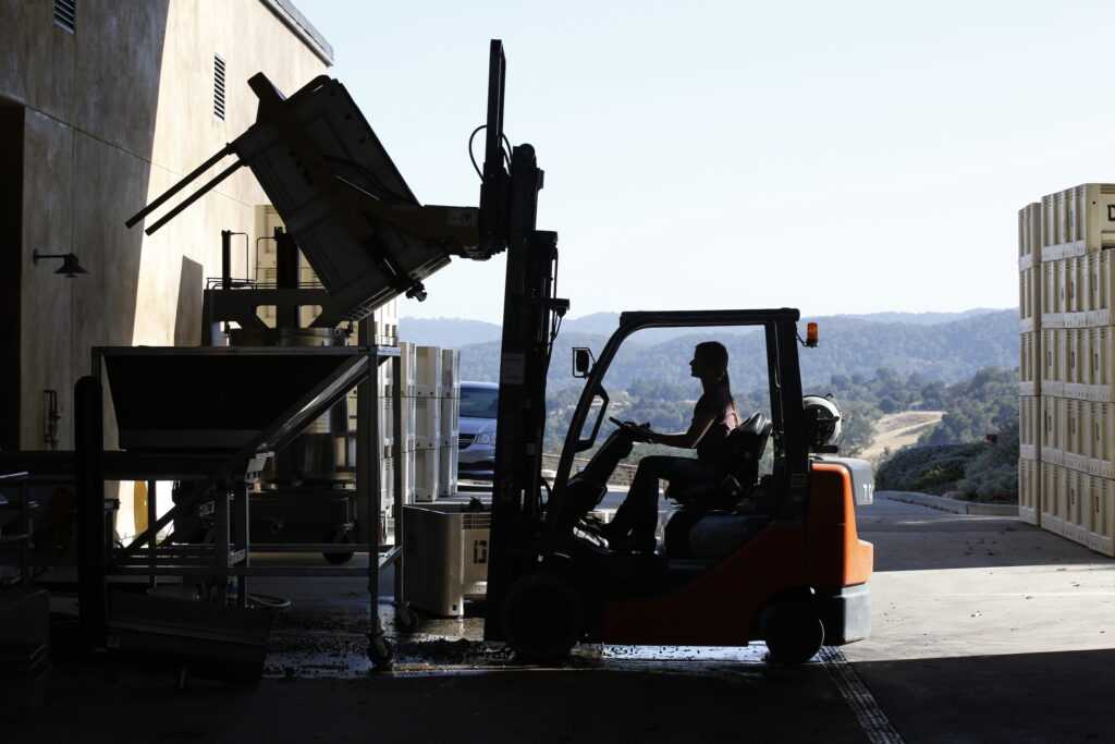 woman driving forklift